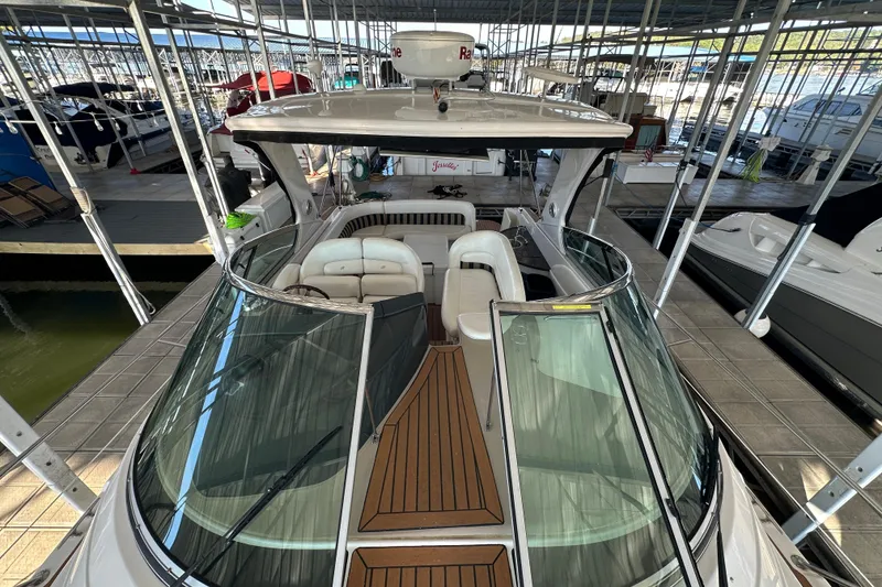 Slide: The Image of 2006 Four Winns 378 Vista yacht docked in a covered marina. - 13