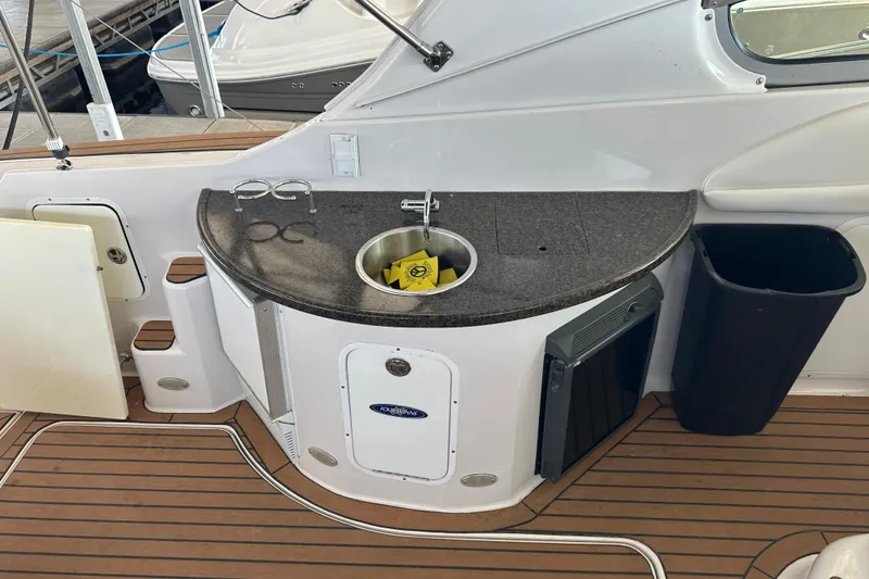 Slide: The Image of 2006 Four Winns 378 Vista boat dashboard with Raymarine navigation systems. - 29