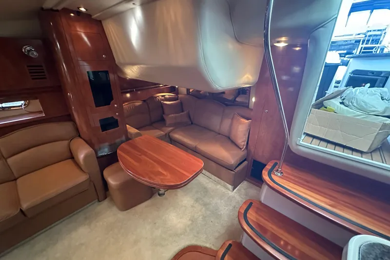 Slide: The Image of 2006 Four Winns 378 Vista yacht interior with seating and kitchenette on deck. - 35