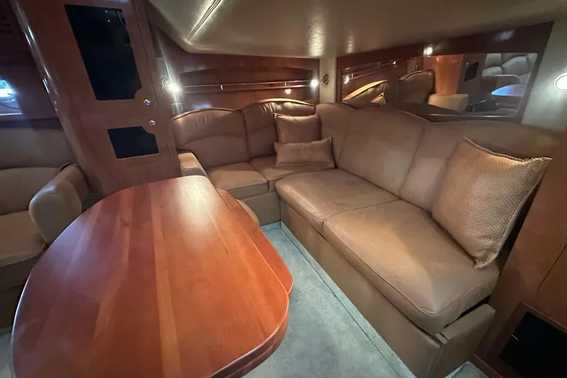 Slide: The Image of 2006 Four Winns 378 Vista yacht interior with curved seating and teak flooring. - 36