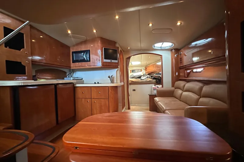 Slide: The Image of 2006 Four Winns 378 Vista yacht kitchenette with sink, countertop, and trash bin. - 39