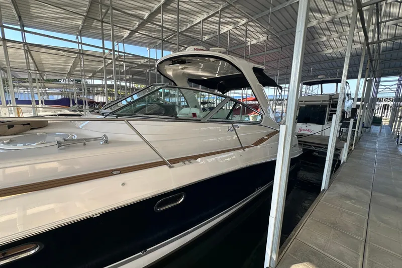 Slide: The Image of 2006 Four Winns 378 Vista boat on a scenic lake with wooded shoreline. - 4