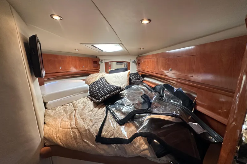 Slide: The Image of 2006 Four Winns 378 Vista boat interior with white seating and wooden flooring. - 42