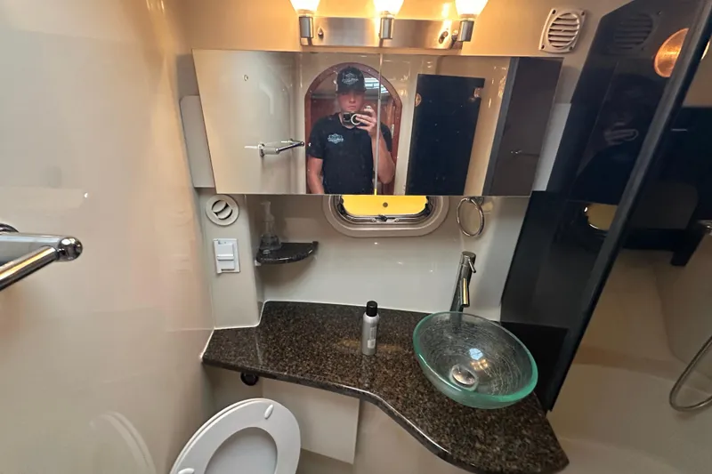 Slide: The Image of Luxurious interior of 2006 Four Winns 378 Vista yacht with plush seating and wooden finishes. - 45