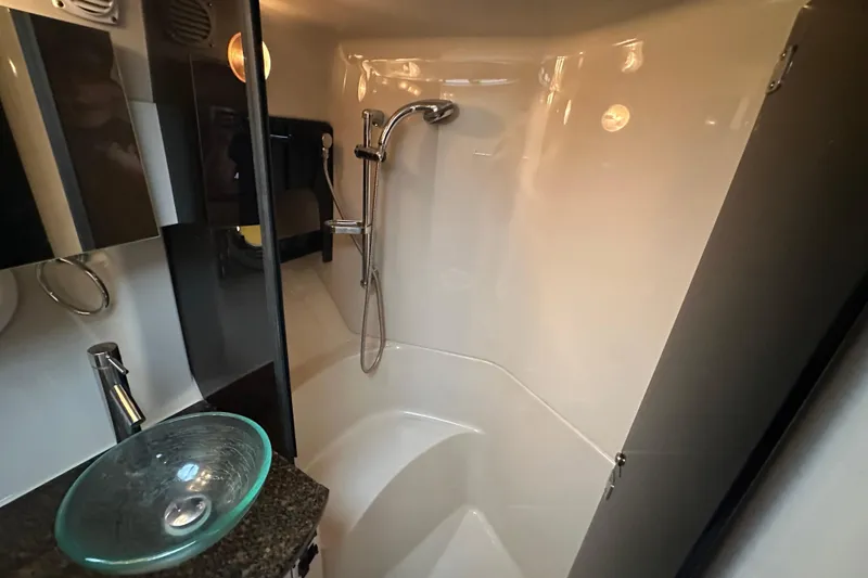 Slide: The Image of Luxurious interior of 2006 Four Winns 378 Vista yacht with plush seating and wooden table. - 46