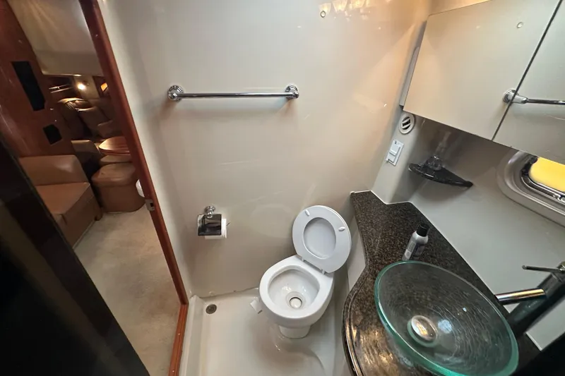 Slide: The Image of Control panel and thermostat on 2006 Four Winns 378 Vista boat interior. - 48