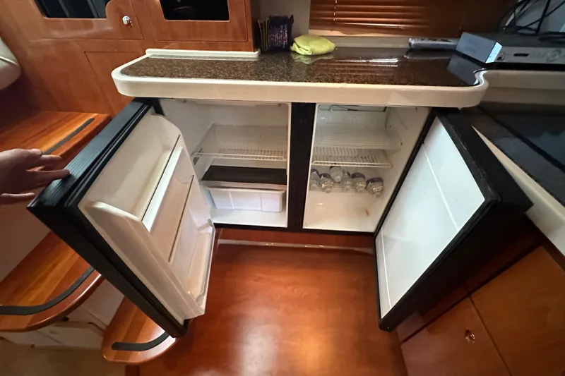 Slide: The Image of Luxurious 2006 Four Winns 378 Vista yacht interior with modern kitchen and wood cabinetry. - 50