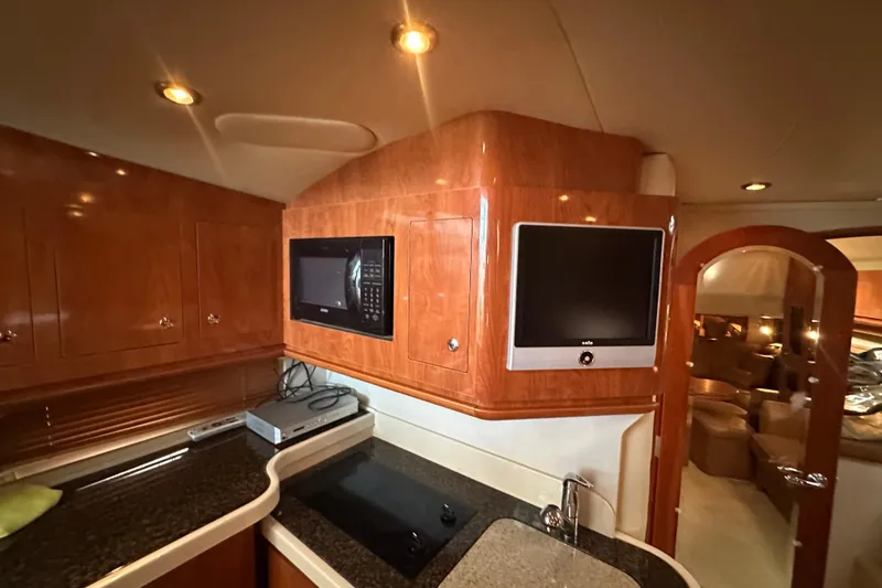 Slide: The Image of Luxurious cabin interior of 2006 Four Winns 378 Vista yacht with cozy bedding. - 52