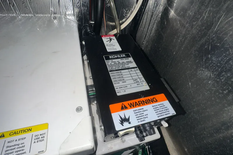 Slide: The Image of Control panel of a 2006 Four Winns 378 Vista boat with illuminated switches. - 63