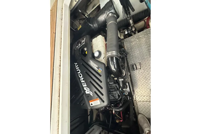 Slide: The Image of Engine compartment of 2006 Four Winns 378 Vista with Mercury engine components. - 71