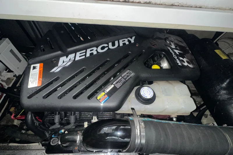 Slide: The Image of Mercury engine in a 2006 Four Winns 378 Vista boat, showcasing MerCruiser 8.1L components. - 76