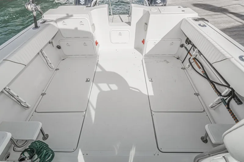 Slide: The Image of Spacious deck of 2007 Glacier Bay 2680 Coastal Runner boat, featuring ample seating and storage. - 17