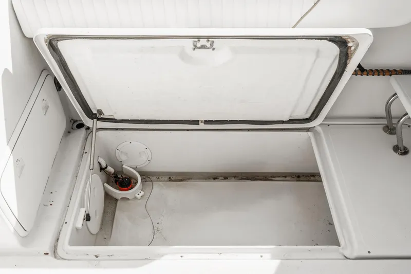Slide: The Image of Open storage compartment on a 2007 Glacier Bay 2680 Coastal Runner boat. - 19
