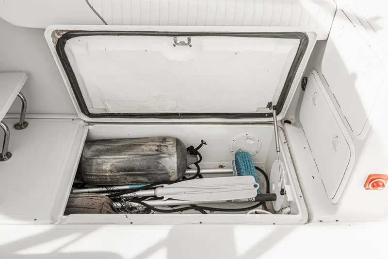 Slide: The Image of Storage compartment of 2007 Glacier Bay 2680 Coastal Runner with equipment and supplies. - 21