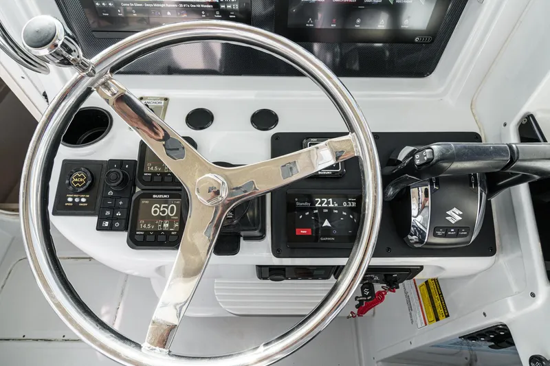 Slide: The Image of Steering wheel and controls of 2007 Glacier Bay 2680 Coastal Runner boat. - 28