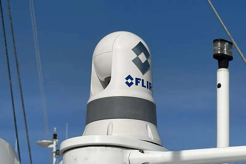 Slide: The Image of FLIR camera on 2007 Glacier Bay 2680 Coastal Runner against clear blue sky. - 32