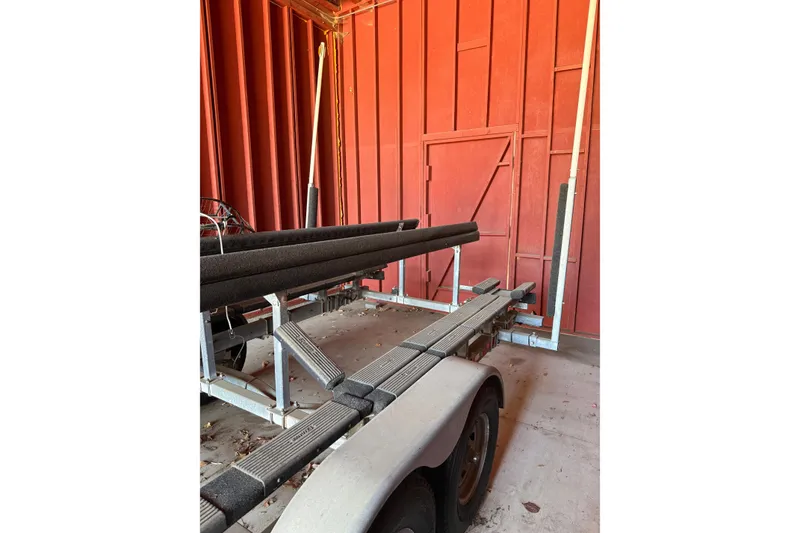 Slide: The Image of Trailer for 2007 Glacier Bay 2680 Coastal Runner in a red storage area. - 41