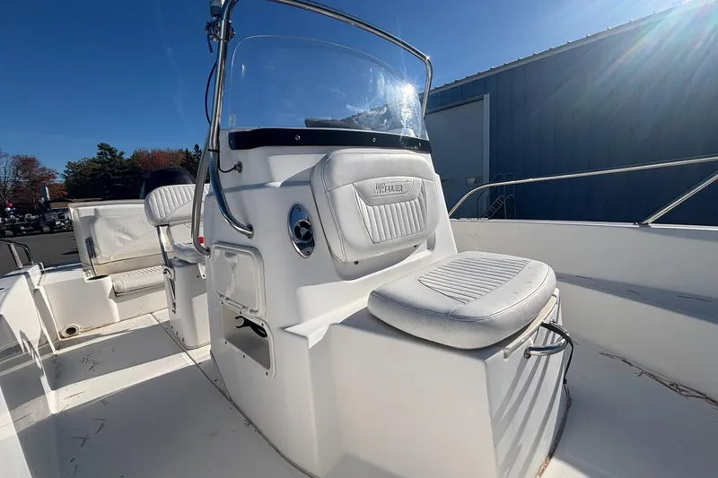 Slide: The Image of 2008 Boston Whaler 180 Dauntless boat interior with seating and console. - 10