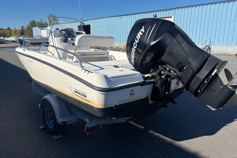 Slide: The Image of 2008 Boston Whaler 180 Dauntless boat with Mercury engine on trailer. - 3