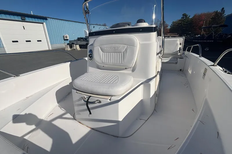 Slide: The Image of 2008 Boston Whaler 180 Dauntless boat interior with white seating and console. - 6