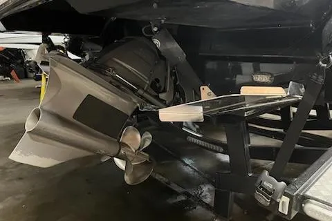 Slide: The Image of 2016 Monterey 238 Surf boat propeller and stern in a garage setting. - 10