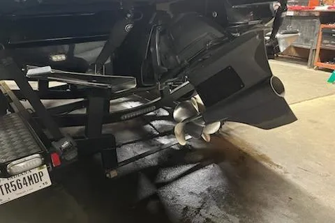 Slide: The Image of 2016 Monterey 238 Surf boat propeller and trailer in a garage setting. - 11