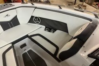 Slide: The Image of 2016 Monterey 238 Surf boat interior with white and black seating. - 16