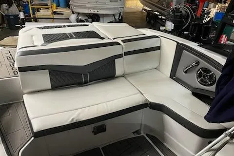 Slide: The Image of 2016 Monterey 238 Surf boat interior with white and gray seating. - 8
