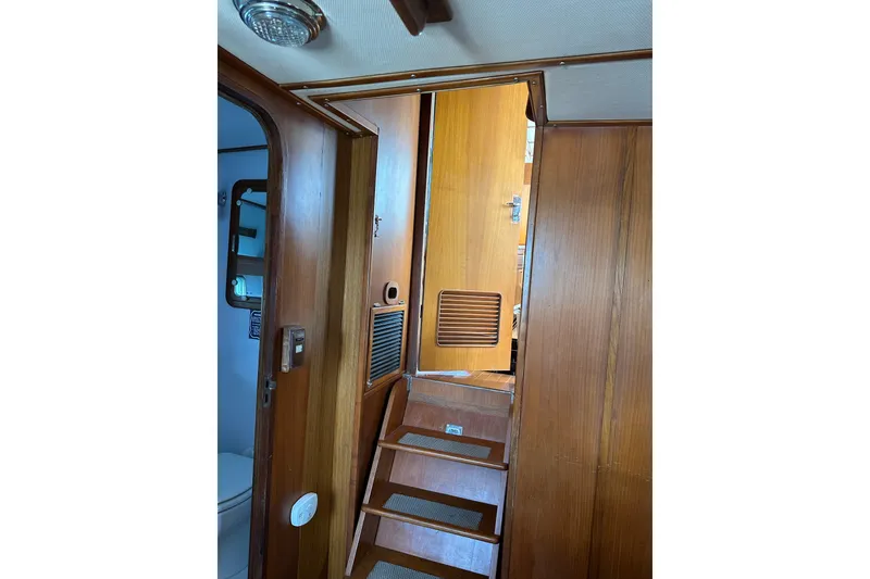 Slide: The Image of Interior of 1987 Albin North Sea Trawler with wooden stairs and door. - 15
