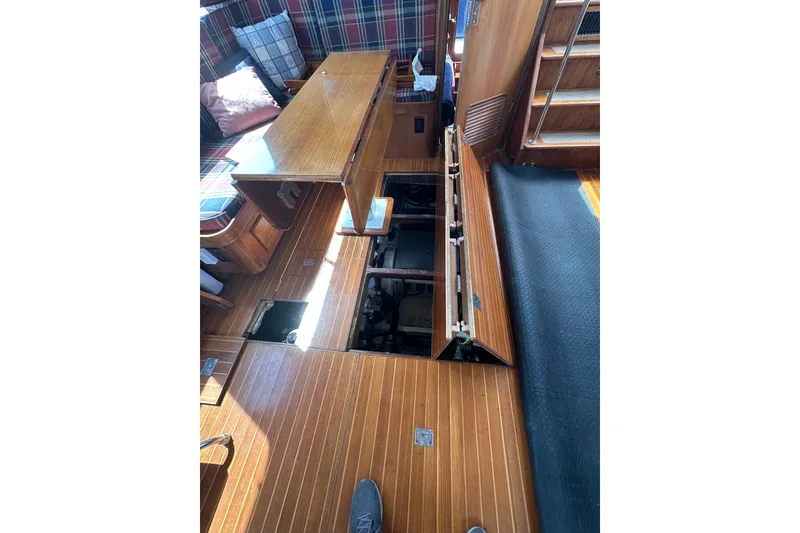 Slide: The Image of 1987 Albin North Sea Trawler interior with open floor panels revealing engine compartment. - 32