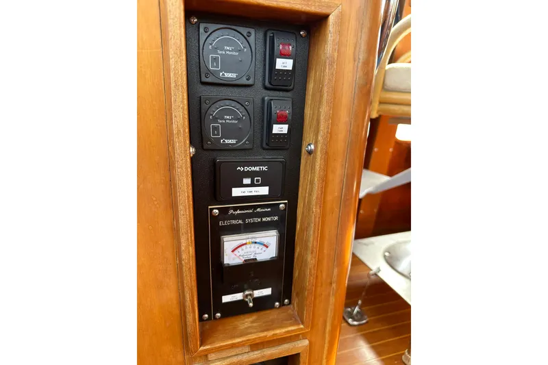 Slide: The Image of Control panel of a 1987 Albin North Sea Trawler with gauges and electrical system monitor. - 74