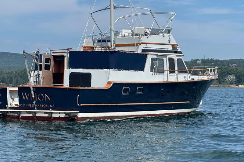 The Image of 1987 Albin North Sea Trawler in water, Southwest Harbor, ME, clear sky background. - 0
