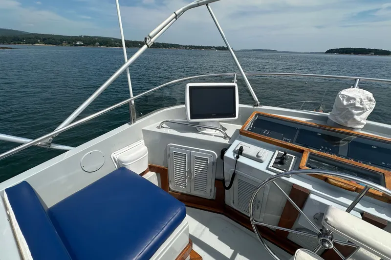 Slide: The Image of Helm of 1987 Albin North Sea Trawler with blue seating and navigation equipment. - 19