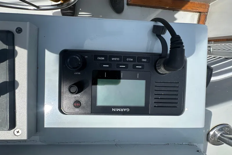 Slide: The Image of Garmin marine radio on 1987 Albin North Sea Trawler dashboard. - 20