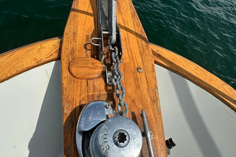 Slide: The Image of Anchor and windlass on 1987 Albin North Sea Trawler, wooden deck, ocean background. - 29