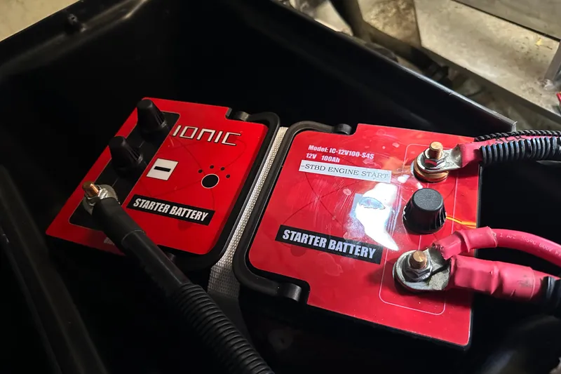 Slide: The Image of Starter battery setup in 1987 Albin North Sea Trawler, featuring Ionic 12V 100Ah model. - 37