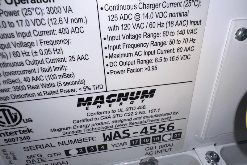 Slide: The Image of Label on Magnum charger detailing specifications and serial number for Albin North Sea Trawler, 1987. - 41