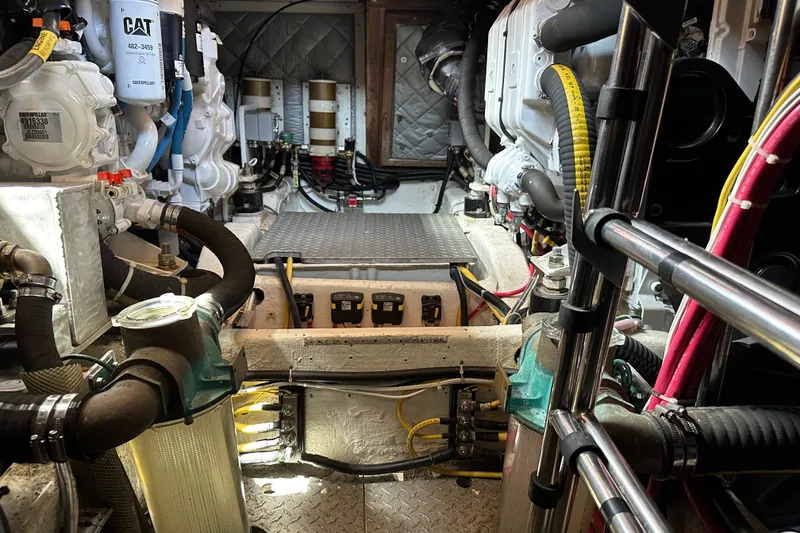 Slide: The Image of Engine room of 1987 Albin North Sea Trawler with visible machinery and wiring. - 42