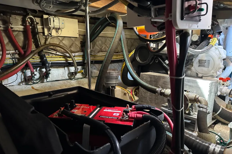 Slide: The Image of Engine room of 1987 Albin North Sea Trawler with visible wiring and battery. - 43