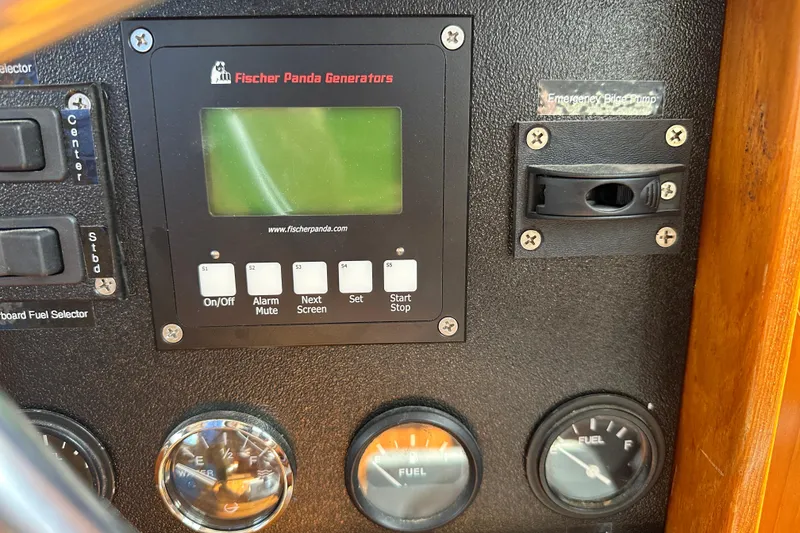 Slide: The Image of Control panel of a 1987 Albin North Sea Trawler with Fischer Panda generator display. - 46