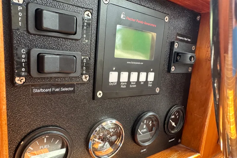 Slide: The Image of Control panel of a 1987 Albin North Sea Trawler with fuel gauges and switches. - 48