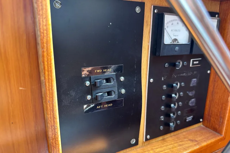 Slide: The Image of Control panel of a 1987 Albin North Sea Trawler with switches and voltmeter. - 49