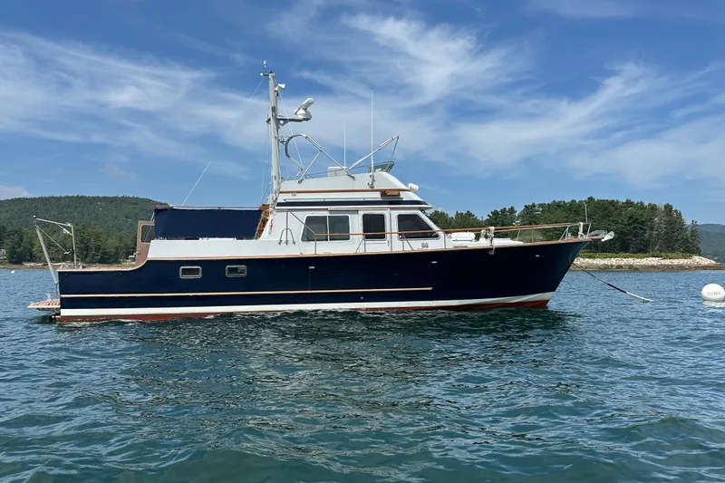 Slide: The Image of 1987 Albin North Sea Trawler on calm water, scenic background, clear sky. - 5
