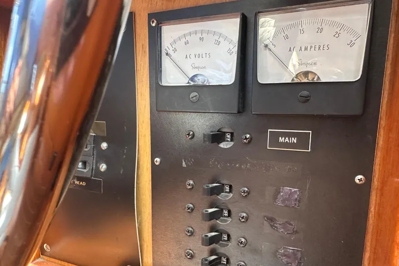 Slide: The Image of Control panel of a 1987 Albin North Sea Trawler with AC volt and ampere meters. - 50
