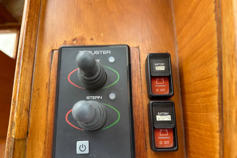 Slide: The Image of Control panel of a 1987 Albin North Sea Trawler with switches and joysticks. - 54