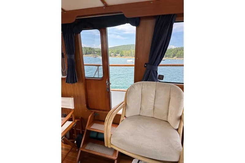 Slide: The Image of Interior of 1987 Albin North Sea Trawler with scenic water view through windows. - 58