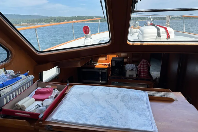 Slide: The Image of 1987 Albin North Sea Trawler interior with navigation map and sea view. - 59
