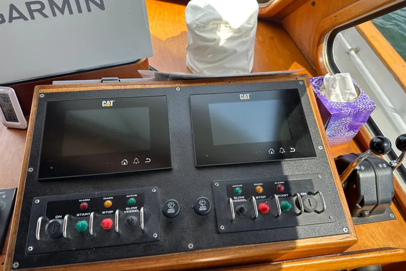 Slide: The Image of Control panel of a 1987 Albin North Sea Trawler with CAT displays and switches. - 60