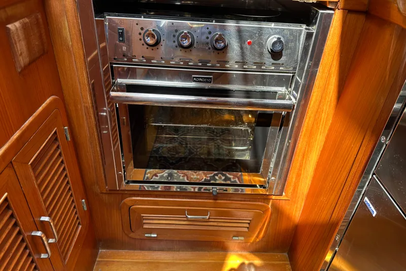 Slide: The Image of Wooden interior of 1987 Albin North Sea Trawler with built-in stainless steel oven. - 61