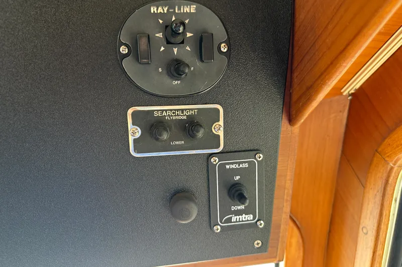 Slide: The Image of Control panel of a 1987 Albin North Sea Trawler with searchlight and windlass switches. - 62